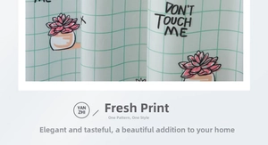 Detail of mint green plaid curtain with succulent prints and DON'T TOUCH ME slogan