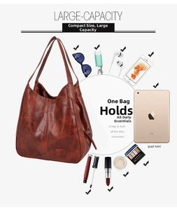 Deep brown large capacity tote bag displaying interior storage for iPad and makeup