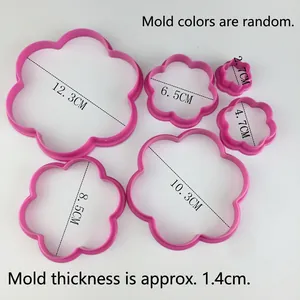 Set of 5 pink flower-shaped cookie cutters in various sizes for baking and DIY