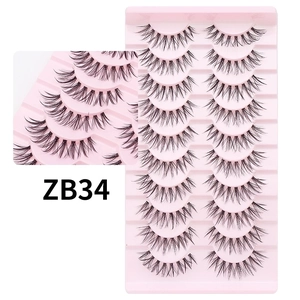 Detail of 10 pairs cross-style false eyelashes with thin fishing line band on tray