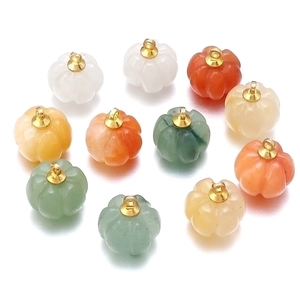Colorful pumpkin shaped aventurine agate pendants with gold metal rings on white background