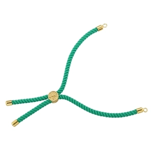 Detail of green woven cord bracelet with adjustable gold metal slider and end caps