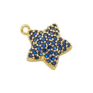 Detailed view of 18K gold star pendant set with navy blue crystals and top hanging ring