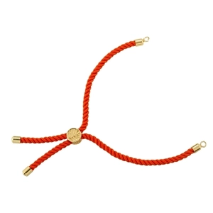 Macro detail of red woven Tree of Life cord with adjustable golden pattern bead