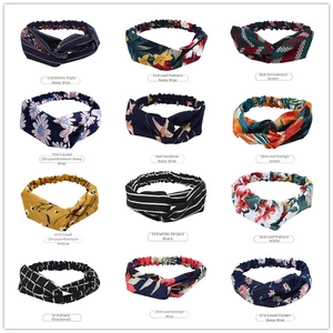 Detail showing twelve printed elastic yoga headbands with diverse patterns and colors