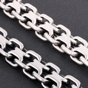 Macro shot of vintage style stainless steel curb chain links with distressed silver finish