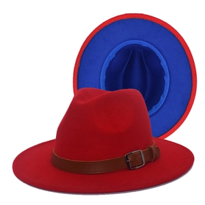 Flat top red wool fedora hat with blue contrast brim and brown faux leather belt strap