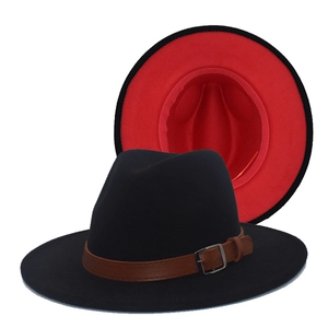 Detail of the black wool fedora with a red interior lining and brown leather belt