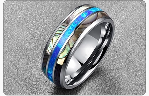 Close-up of titanium steel ring featuring colorful abalone shell and blue opal inlay
