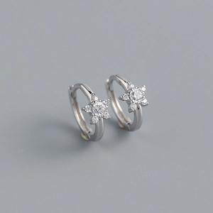 Close-up of minimalist S925 silver star earrings with sparkling cubic zirconia inlay