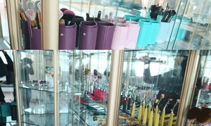 Close-up of colorful PU leather makeup brush holders and professional cosmetic brushes