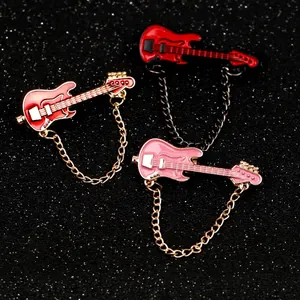 Stylish mini electric guitar enamel brooches in red and pink with decorative gold chains