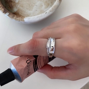 French style 925 sterling silver ring with irregular lava texture worn on index finger