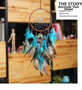 Detailed close-up of Bohemian tree of life dreamcatcher with natural feathers and beads