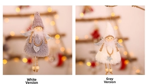 Detail of plush Christmas angel ornaments in grey and white with sequined wings