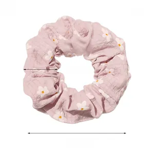 Detail view of pink floral hair scrunchie with 11cm diameter measurement and weight specs