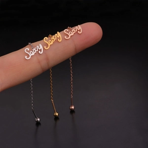 Minimalist 'Sexy' word drop earrings in silver, gold, and rose gold stainless steel