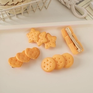 Cute simulation biscuit hair clips in star and heart shapes on a white tray