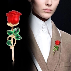 Elegant red enamel rose brooch with golden stem and green leaves, close-up and model shot