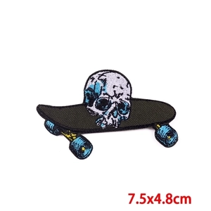 Detail of 7.5x4.8cm skateboard skull embroidered patch with intricate stitching