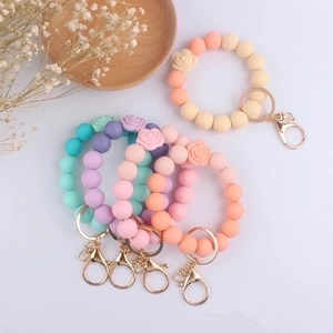 Macaron color silicone bead bracelet keychain with daisy flower in multiple pastel shades