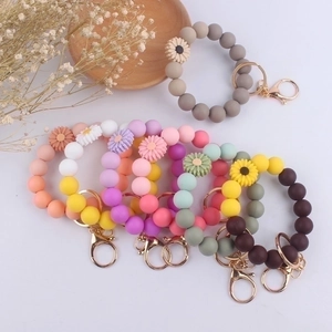 Colorful silicone bead bracelet keychain with sunflower charm and gold metal rings