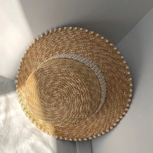 Elegant khaki straw boater hat with double-row pearl trim and flat top for sun protection