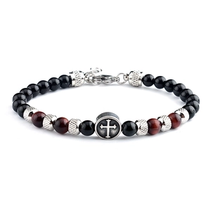 Detail of beaded bracelet with black tiger eye stones, silver cross charm, and lobster clasp