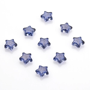 Macro detail of 10mm dark blue star crystal charms with glitter and center drill hole