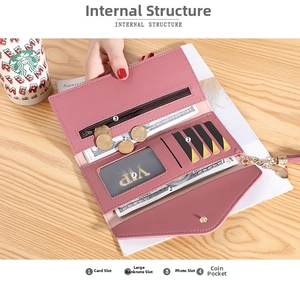 Detail of the pink wallet interior showing card slots, bill layers and coin zipper pocket