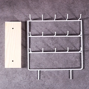 White metal jewelry display stand with wooden base featuring three tiers and 15 hooks
