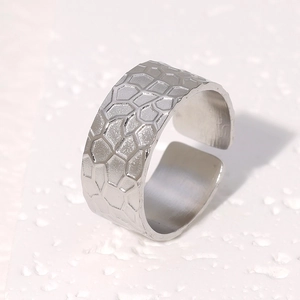Adjustable silver stainless steel wide ring featuring geometric honeycomb texture
