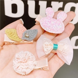 Set of four cute pink fabric hair clips for girls featuring rabbit and flower designs