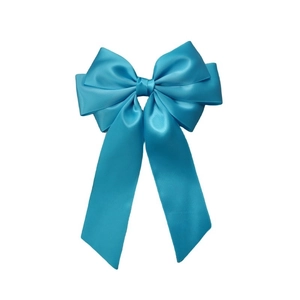 Detail of the sky blue satin bow hair clip with double layers and long flowing ribbons