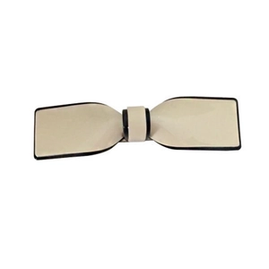 Elegant beige bow hair clip with black edges in minimalist geometric resin style