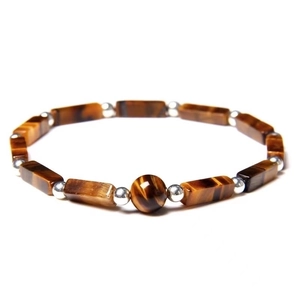 Detailed view of rectangle tiger eye beads with silver spacers on an elastic bracelet