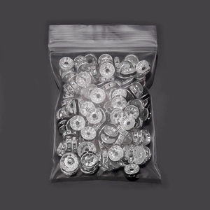 Macro shot of silver rhinestone spacer beads in bulk for DIY bracelet jewelry making