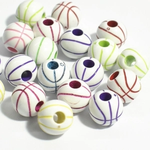 Macro shot of colorful acrylic basketball-shaped loose beads for DIY jewelry making