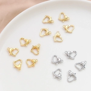 Polished heart-shaped lobster clasps in gold and silver for DIY jewelry making