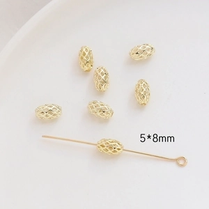 Close-up of 5x8mm gold hollow oval beads for DIY jewelry making and handmade accessories
