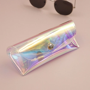 Detailed macro view of laser holographic PVC glasses case with silver metal snap closure
