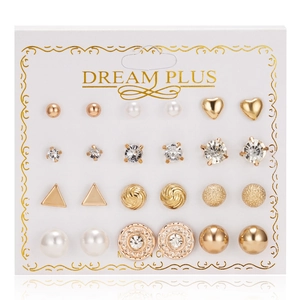 Close-up of 12-pair gold alloy stud earring set with pearls and rhinestones on card