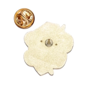 Detail view of the gold alloy badge back showing textured finish and butterfly clutch pin