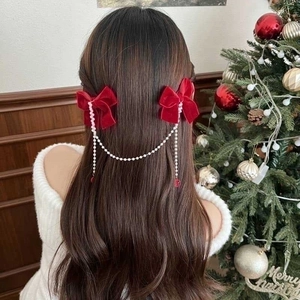 Elegant red velvet bow hair clip with pearl chain tassels for girls' holiday hair styling