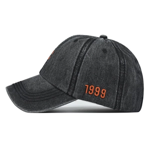 Vintage washed cotton baseball cap with orange 1999 embroidery and side profile view