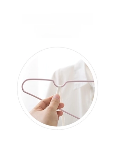 Close-up of pink non-slip clothes hanger featuring shoulder notches for thin straps