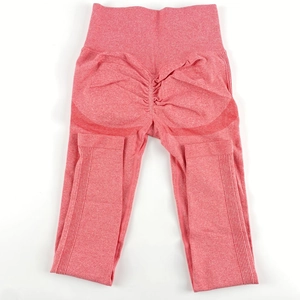 Detailed view of high-waist scrunch butt seamless leggings in heather coral pink