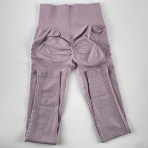 Macro detail of seamless lavender yoga pants showing high-waist ribbing and peach lift texture