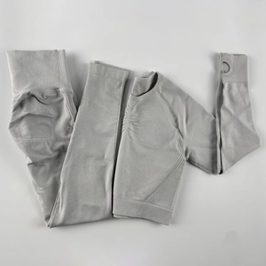 Flat lay of seamless yoga set showing ribbed texture and functional thumbholes
