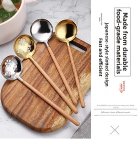 Detail of 304 stainless steel soup and slotted spoons with beech wood handles on a board